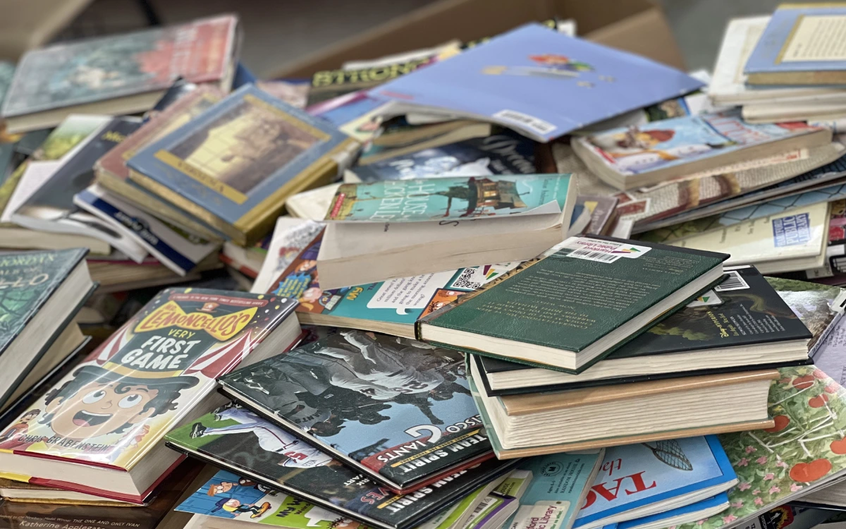 A pile of books and magazines on top of each other.